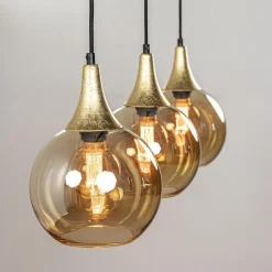 Chique 3-lichts hanglamp zwart/goud met amber glas><noscript><img width=